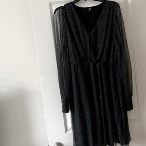 Black party dress with silver sparkles, sheer long sleeves.  Only worn once.